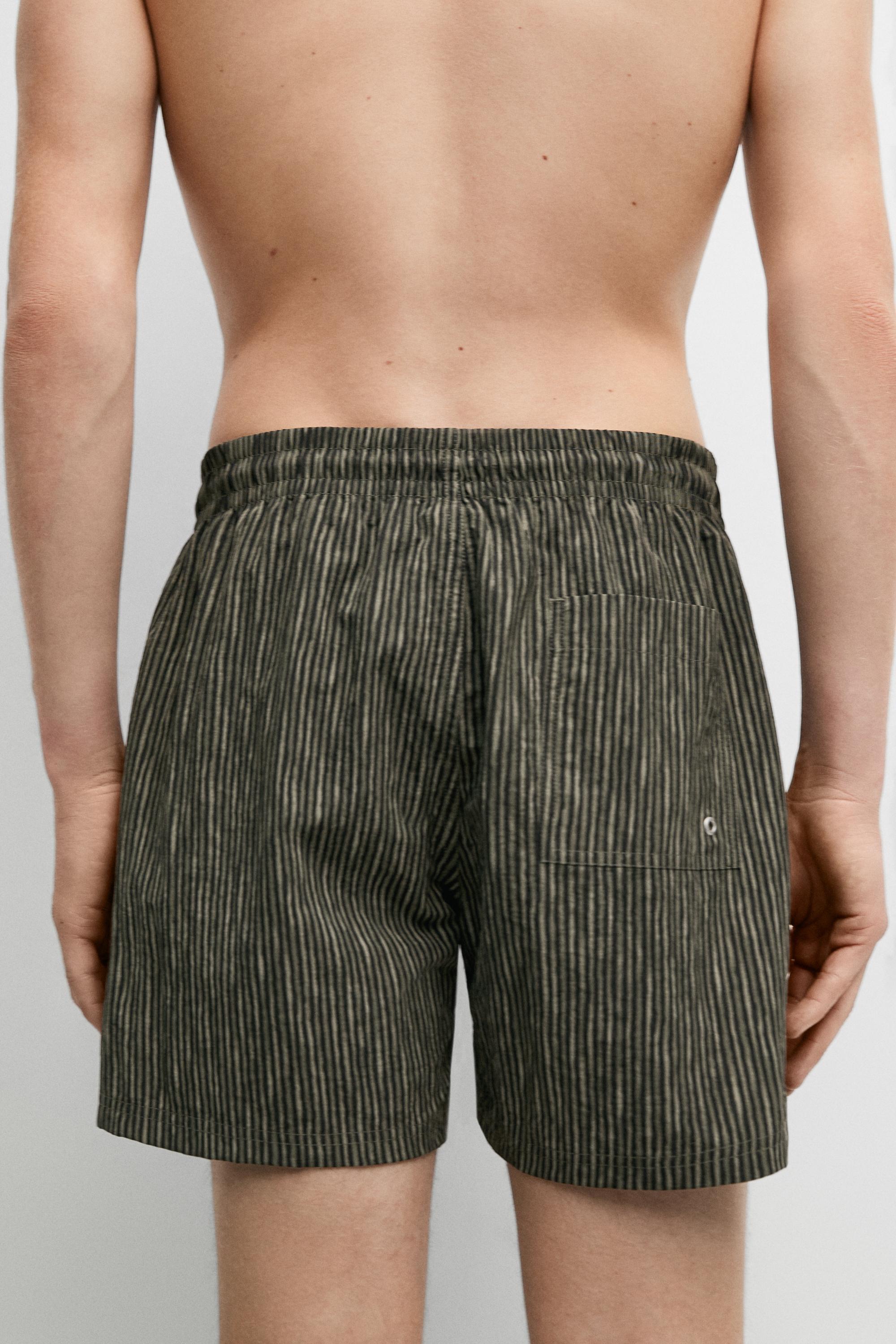 Striped print swimming trunks